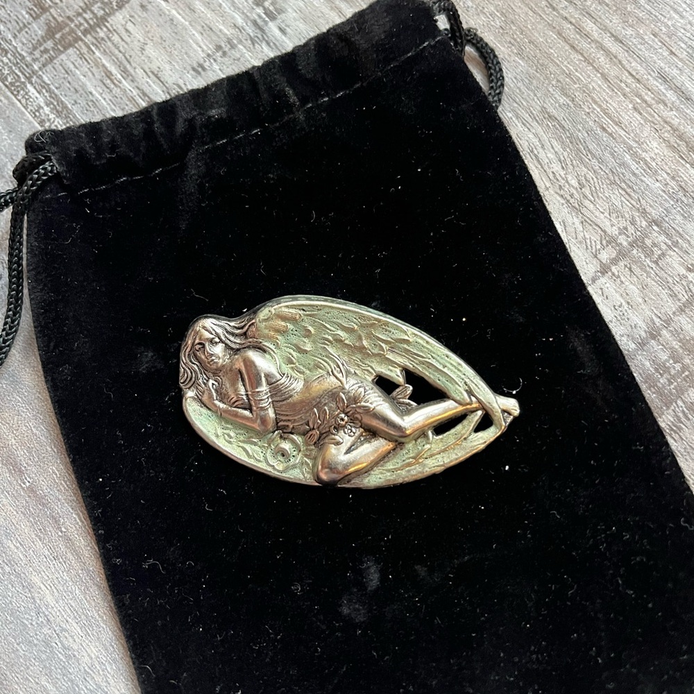 Silver tone angel brooch